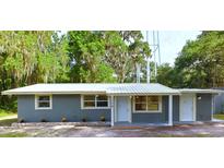 Newly renovated home with gray siding and metal roof at 1778 Cr 426, Lake Panasoffkee, FL 33538