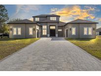 Two-story home with a paver driveway and landscaped lawn at 20344 Sheldon St, Orlando, FL 32833