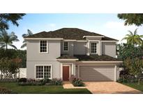 Two-story house with gray siding, brown roof, and a two-car garage at 2590 Launchpad Ave, Saint Cloud, FL 34769