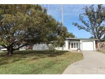 Ranch style home with carport and mature landscaping at 913 Carlson Dr, Orlando, FL 32804