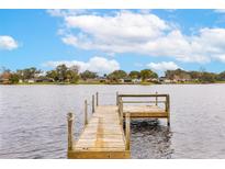 Wooden dock extending over calm water, offering scenic views at 116 Sheridan Ave, Longwood, FL 32750