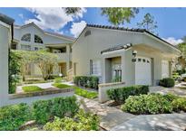 Attractive exterior of a two-story condo with landscaping and a two-car garage at 3992 Radley Ct, Longwood, FL 32779