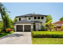 Beautiful two-story home with a well-manicured lawn and a two-car garage at 6564 Lagoon St, Windermere, FL 34786