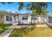 Charming single story home with landscaped lawn and attached garage at 2901 Primrose Ct, Orlando, FL 32803