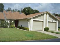 Charming single-story home with attached garages, manicured lawn and mature landscaping at 184 Hill St # 184, Casselberry, FL 32707