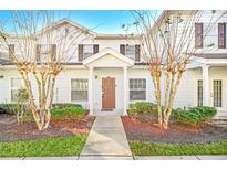 Inviting exterior of a two-story home with landscaping and walkway at 2956 Lucayan Harbour Cir # 107, Kissimmee, FL 34746