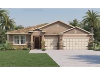 Beautiful one-story home with stone accents and a two-car garage at 1694 Three Bars Rd, Kissimmee, FL 34744