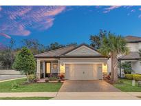 Stunning curb appeal! This home features a two-car garage and a beautifully landscaped yard at 1401 Lone Feather Trl, Winter Park, FL 32792