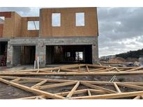 New townhome construction with attached garage, under construction at 4295 Campsite Loop, Orlando, FL 32824