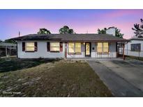 Charming single story home with a well-maintained front yard and driveway at 5005 Kipp Pl, Orlando, FL 32808