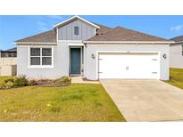 Curb appeal abounds in this charming one-story home, featuring a two-car garage at 776 Rioja Dr, Minneola, FL 34715