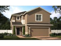 Two-story house with brown exterior, two-car garage, and landscaping at 7100 Cherry Pasture Rd, Groveland, FL 34736