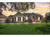 Beautiful two-story house with a landscaped lawn and a brick driveway at 32604 View Haven Ln, Sorrento, FL 32776