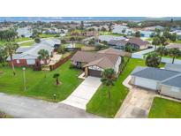 Aerial view of a single-Gathering home with a spacious yard, located near the ocean at 4 Sea Hawk Dr, Ormond Beach, FL 32176