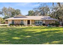 Charming ranch home with stone facade and spacious lawn at 846 Leopard Trl, Winter Springs, FL 32708