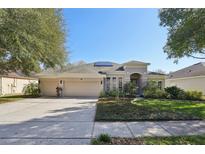 Beautiful two-story home with a three-car garage and solar panels at 2647 Aloma Oaks Dr, Oviedo, FL 32765