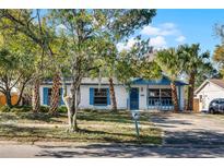 Charming single story home with mature landscaping and a large driveway at 881 Kimball Dr, Ocoee, FL 34761