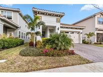Beautiful home with landscaping, driveway, and two-car garage at 13567 Abberwick Dr, Orlando, FL 32832
