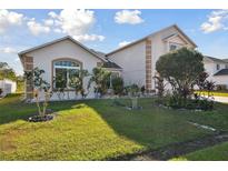 Charming single-Gathering home with landscaped front yard and inviting curb appeal on a sunny day at 193 Aurelia Ct, Kissimmee, FL 34758