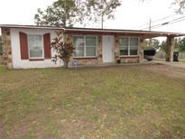 Ranch style home with carport and mature landscaping at 4366 Kirkland Blvd, Orlando, FL 32811