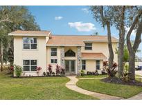 Two-story house with stone accents and landscaping at 5032 River Lake Rd, Winter Haven, FL 33884