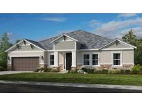 One-story home with gray siding, brown garage door, and stone accents at 2971 Arranmore Dr, Ormond Beach, FL 32174