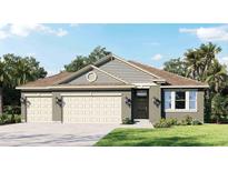 Two-story house with neutral siding, three-car garage, and landscaping at 3238 Arch Ave, Ormond Beach, FL 32174