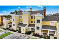 Luxury townhome community boasts elegant architecture and attractive landscaping at 1310 Seven Eagles Ct # 301, Reunion, FL 34747