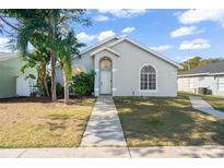 Newly renovated home with a gray exterior, landscaping, and walkway at 530 San Gabriel Ct, Winter Springs, FL 32708