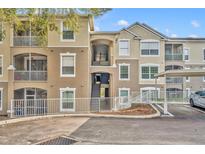 Exterior view of condo building with parking and landscaping at 588 Brantley Terrace Way # 303, Altamonte Springs, FL 32714