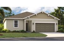 One-story home with two-tone exterior, attached garage, and landscaped lawn at 9158 Harris Hawk Dr, Leesburg, FL 34788