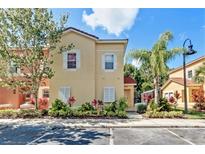 Attractive two-story townhome with landscaping and parking at 4732 Vero Beach Pl, Kissimmee, FL 34746