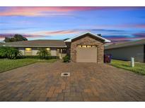 Inviting exterior with stone accents and a paved driveway at 1748 Christina Lee Lane, St Cloud, FL 34769