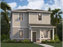 Two-story house with beige siding, dark gray accents, and a landscaped lawn at 430 Belmond Dr, Debary, FL 32713