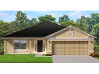 One-story house with a tan exterior, dark roof, and two-car garage at 4472 Sagefield Dr, St Cloud, FL 34773