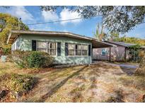 Ranch-style home with carport and mature landscaping at 637 19Th St, Orlando, FL 32805