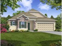 Attractive one-story home with stone accents and a two-car garage at Tbd Ensley Rd, Sorrento, FL 32776