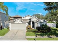 One-story house with a two-car garage and manicured lawn at 15503 Amberbeam Blvd, Winter Garden, FL 34787