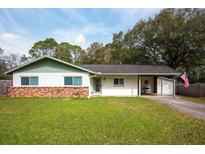 Charming ranch home with brick facade, updated windows and a carport at 318 Satsuma Dr, Sanford, FL 32771