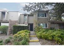 Brick townhouse exterior with a landscaped walkway at 497 Oak Haven Dr, Altamonte Springs, FL 32701