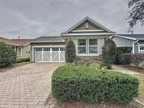 Craftsman style home with stone accents and a two-car garage at 111 Bayou Bend Rd, Groveland, FL 34736
