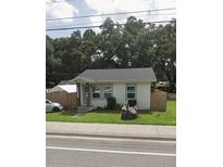Single-story home with a well-maintained lawn and wood fence at 1968 Berkley Rd, Auburndale, FL 33823