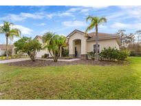 Single-story home with a landscaped yard and a brick driveway at 3181 Winding Trl, Kissimmee, FL 34746