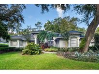 Beautiful home with lush landscaping and a large front yard at 4847 Shoreline Cir, Sanford, FL 32771