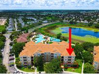 Aerial view of condo community showing resort-style pool and location of condo at 7654 Comrow St # 101, Kissimmee, FL 34747