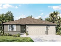 Single-story home with three-car garage and brown roof at 3221 Arch Ave, Ormond Beach, FL 32174