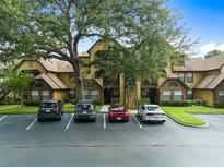 Condo building with ample parking and landscaping at 420 Forestway Cir # 306, Altamonte Springs, FL 32701