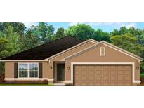One-story house with brown exterior, two-car garage, and landscaping at 4284 Sagefield Drive, St Cloud, FL 34773