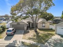 Single-Gathering home with a two-car garage and mature landscaping at 933 El Lago Ter, Winter Springs, FL 32708