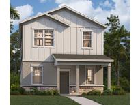 Two-story home with gray siding, stone accents, and a front porch at 554 Orient Ave, Debary, FL 32713